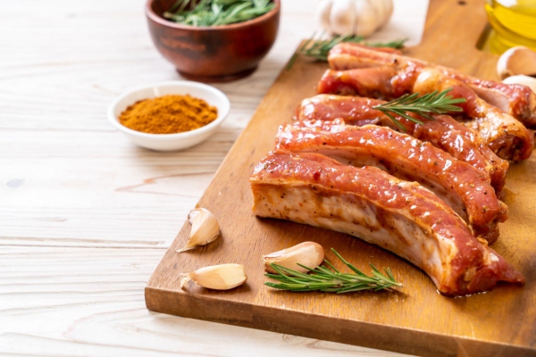 Fresh raw pork ribs ready for roasting with ingredients